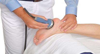 Chiropractic Benson NC Shockwave Therapy On Patients Foot